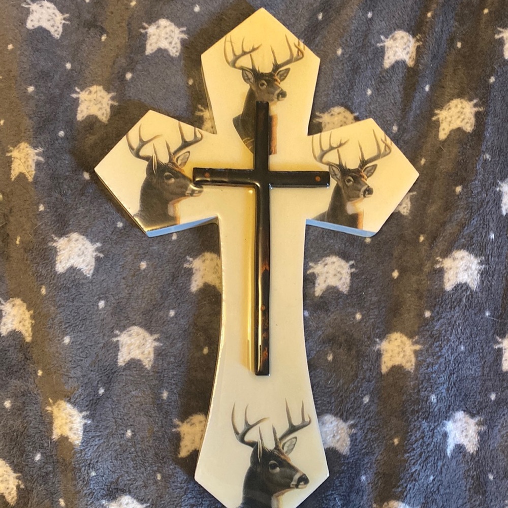 Cross with deers on it